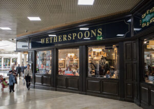 Pub giant JD Wetherspoon has announced it will sell off 32 pubs across the UK due to rising costs.