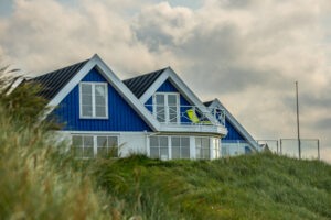 Ministers will make it harder for new properties to be turned into holiday homes under plans to see off a Tory rebellion on planning rules.