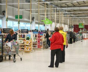 Supermarket chain Asda is considering whether to cut the pay of 7,000 staff in the south east of England to bring it in line with its other stores.