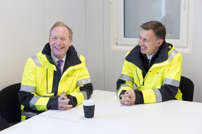Brad Smith, the Microsoft president, left, speaks with Jeremy Hunt, the chancellor, during the visit to Microsoft’s data centre construction site in Acton